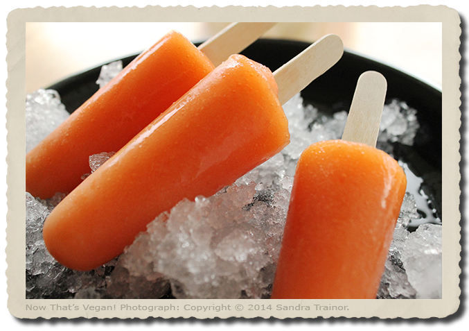 Popsicles made with mango and strawberries.
