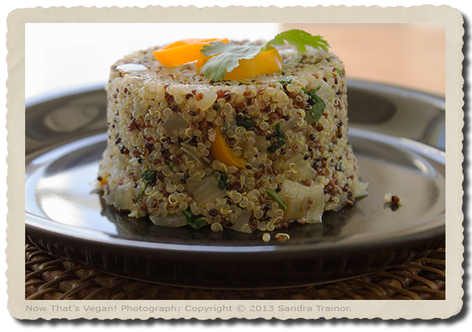 Cooked quinoa with mini sweet yellow peppers.