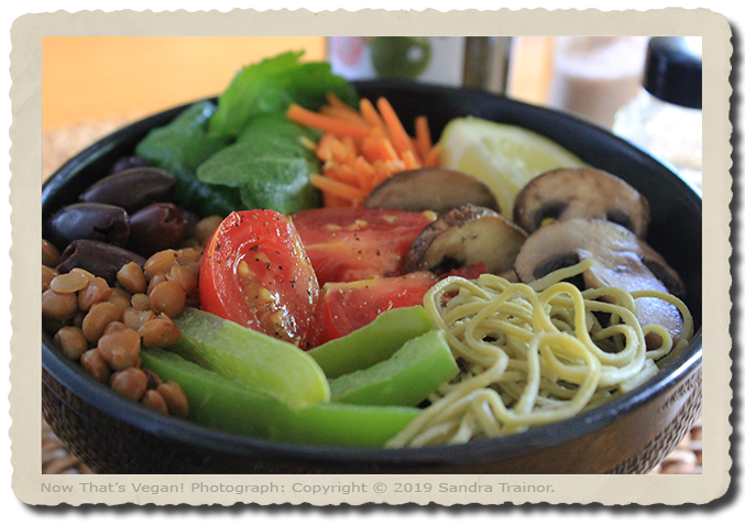 A meal in a bowl made with veggies and pasta.